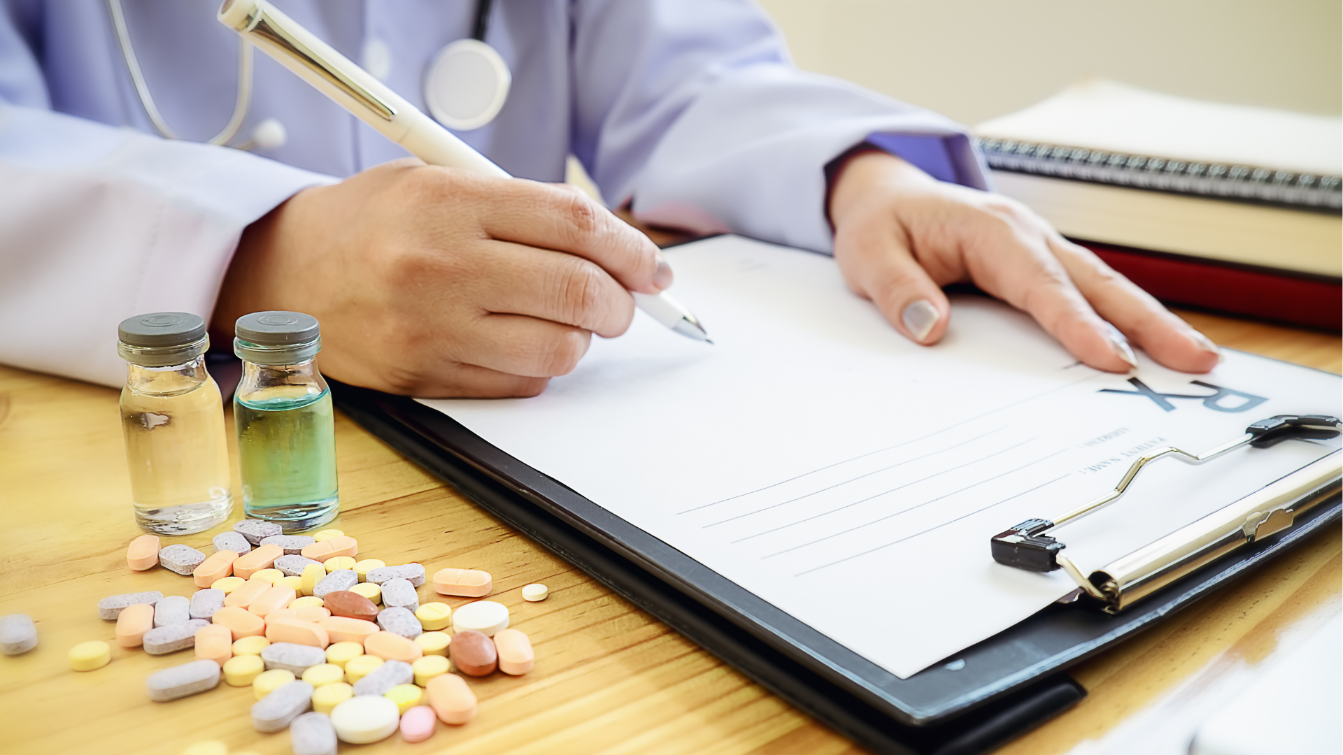 Assorted medicine tablets and capsules on a white background